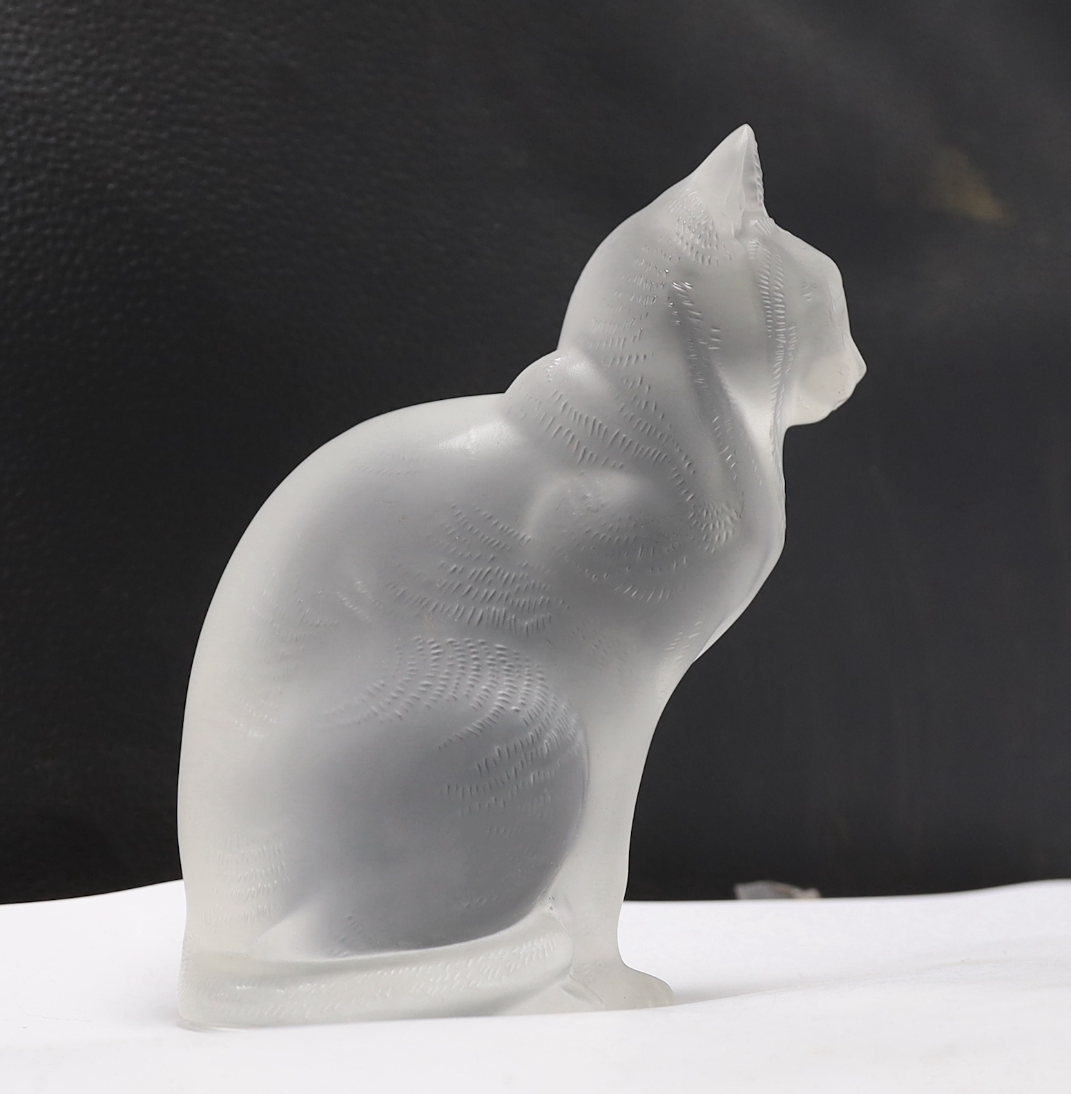 A Lalique glass seated cat, signed to the base, 20cm high